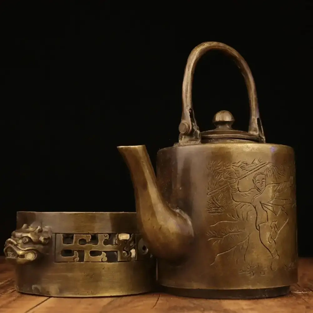 Antique brass teapot with intricate engraved design and dragon-head stand, perfect for warm wine pots and decor