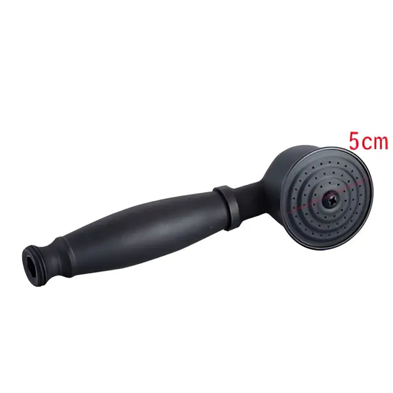 Black matte finish handheld shower head with circular spray face and textured grip in decorbites shower head holder