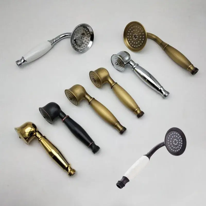 A collection of decorbites antique handheld shower heads in brass chrome and black finishes with holder and hose