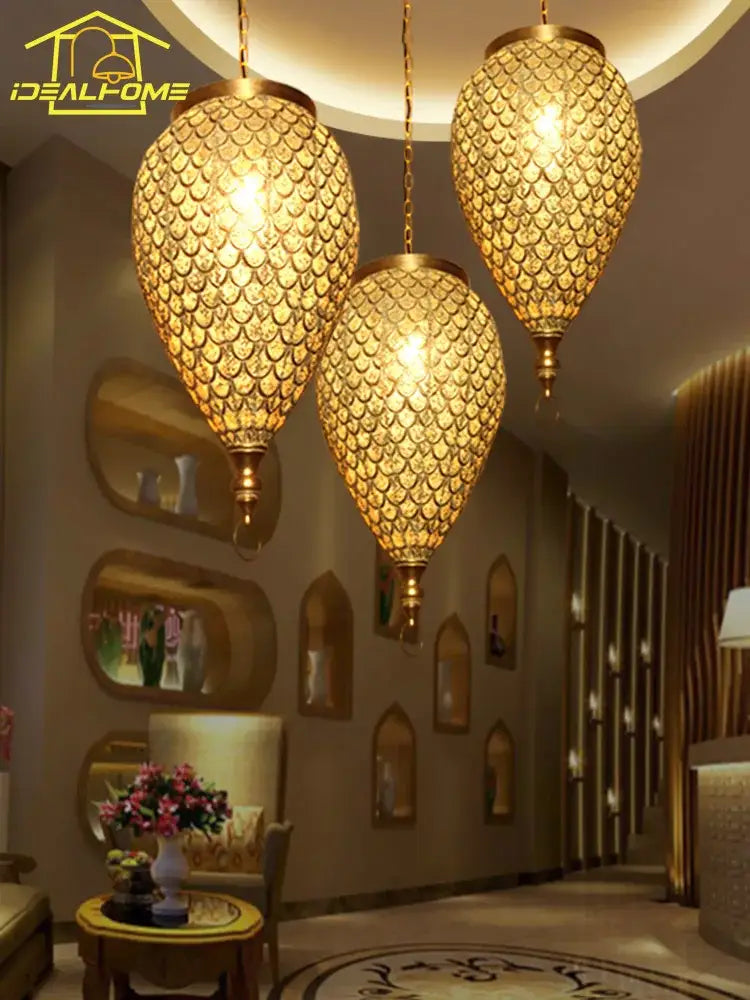 Golden scale-patterned decorbites antique hollow carving pendant light with brass accents for home and hotel decor