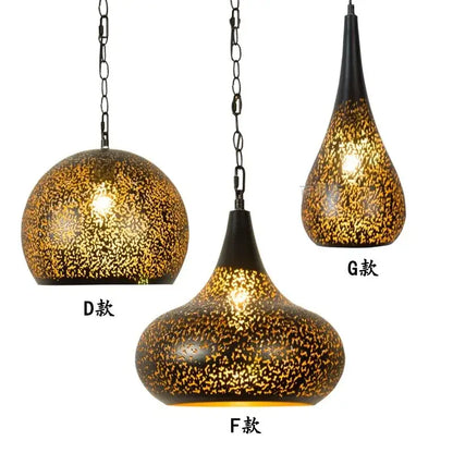 Three ornate decorbites antique hollow carving pendant lights with golden mosaic glass shades and black metal chains
