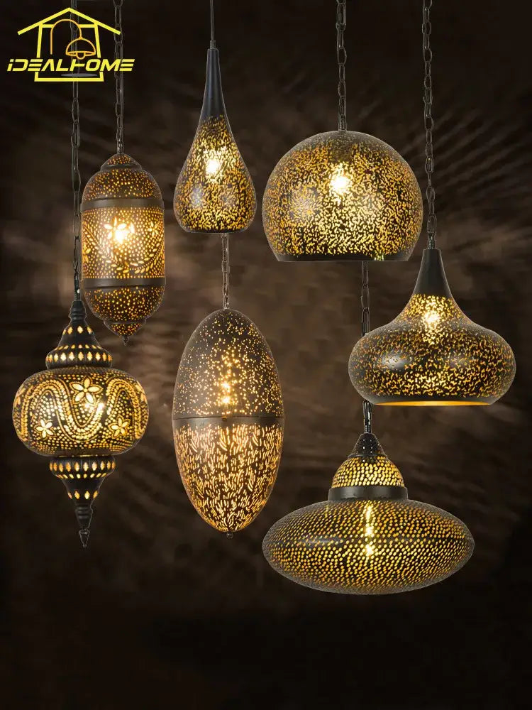 Golden intricately pierced metal pendant light with ornate patterns and warm glowing interiors decorbites antique hollow carving