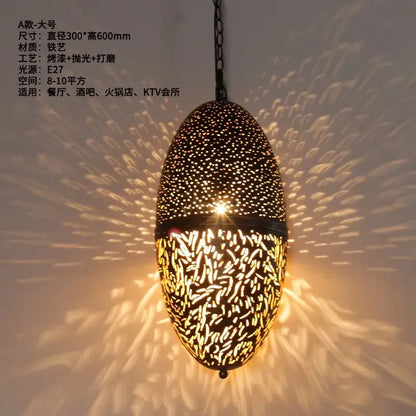 Elegant black iron pendant light with intricate antique hollow carving patterns by DecorBites for vintage home decor