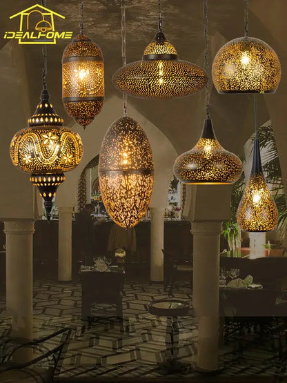 Golden moroccan-style decorbites antique hollow carving pendant light with intricate metalwork and warm glowing interior