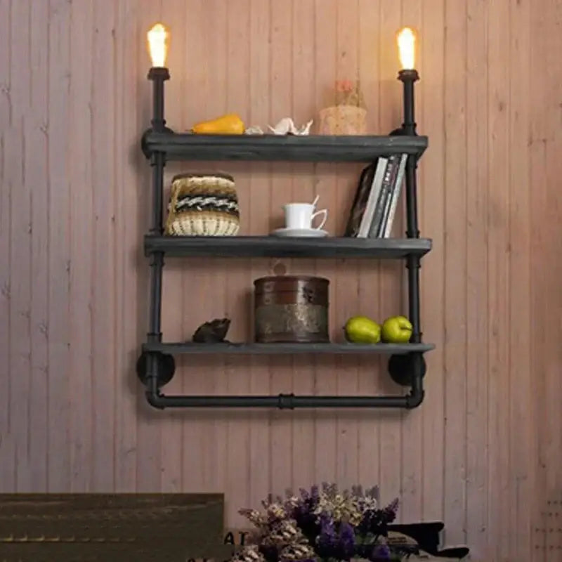 DecorBites antique industrial wall lamp featuring a black pipe shelving unit with three tiers and exposed filament bulbs