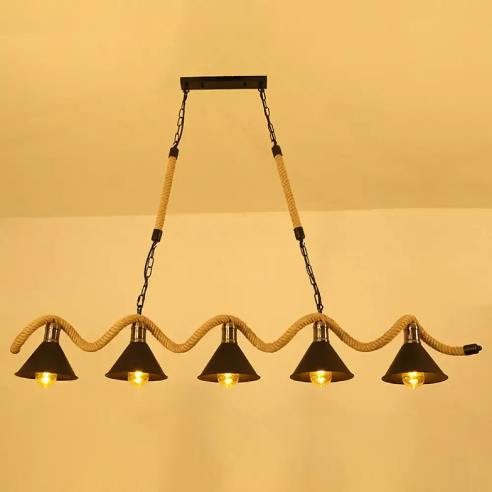DecorBites antique iron hanging island light in black with four conical shades suspended by hemp rope and chain