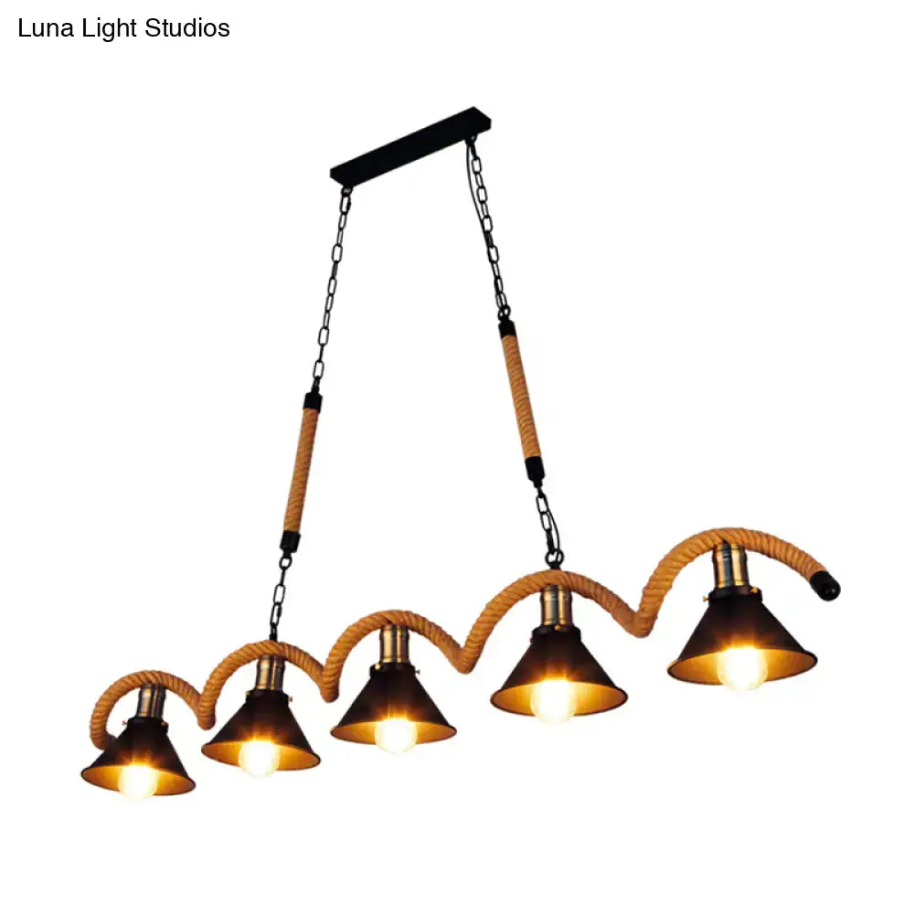DecorBites™ antique iron hanging island light with five brass conical shades, black metal chains, and hemp rope accents