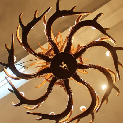 DecorBites antique resin antler chandelier with dark rustic finish and warm golden accents luxury vintage lighting fixture