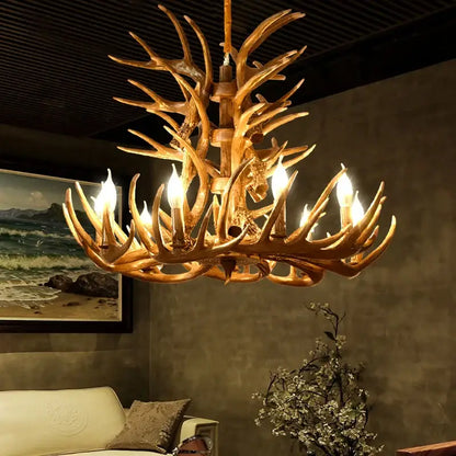 Decorbites antique resin antler chandelier with golden finish and multiple lit candle style bulbs for vintage lighting
