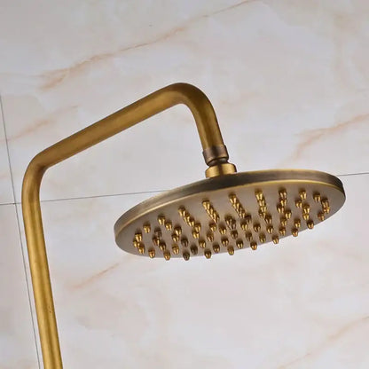 Antique brass round showerhead with curved arm and multiple nozzles in DecorBites™ shower mixer tap set