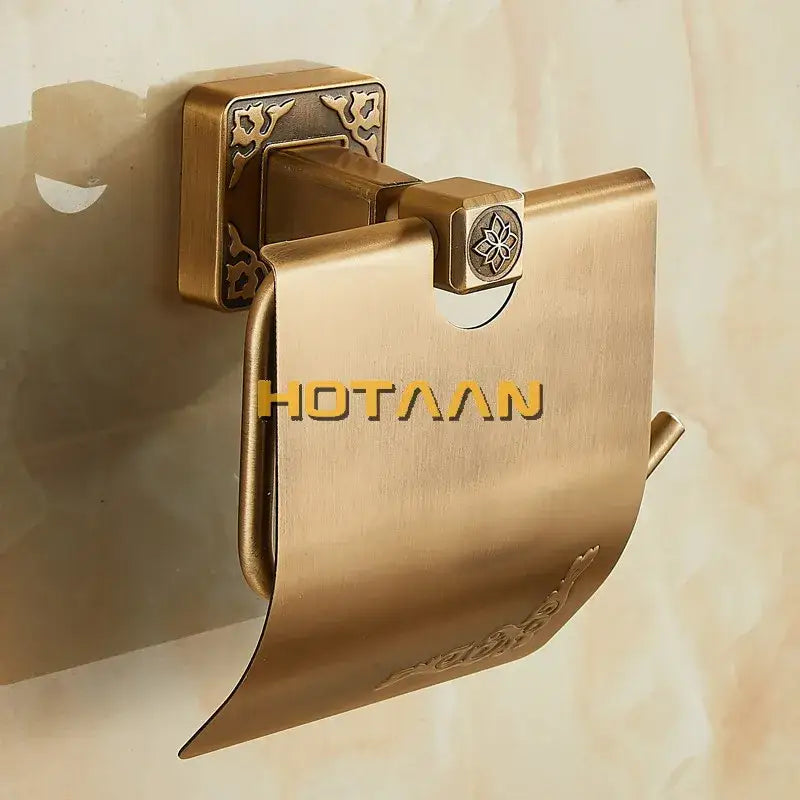 DecorBites antiqued brass toilet paper holder with ornate floral embossing and decorative square wall mount