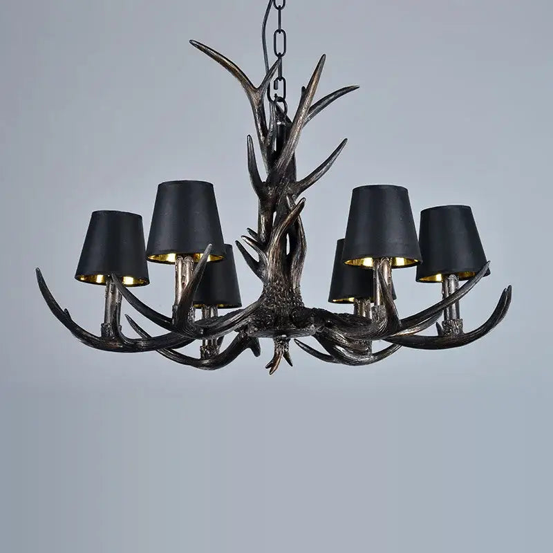 DecorBites antler chandelier with black fabric shades and metallic accents for rustic bedroom dining room lighting
