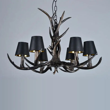 DecorBites antler chandelier with black fabric shades and metallic accents for rustic bedroom dining room lighting