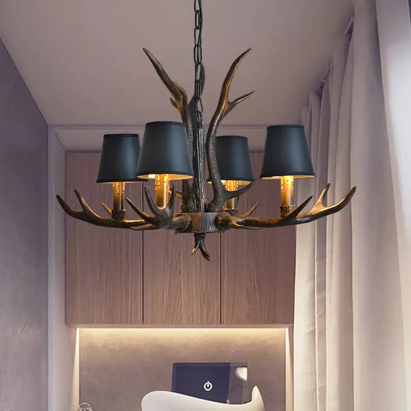 Decorbites antler chandelier with dark bronze finish and black lampshades for rustic bedroom and dining room lighting