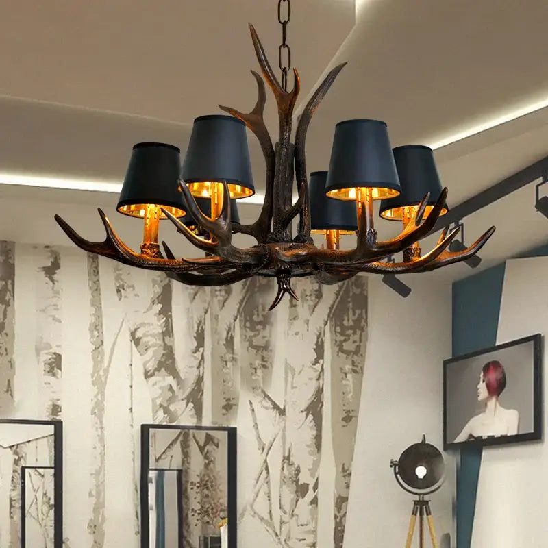 DecorBites antler chandelier with dark bronze finish and black lampshades for rustic bedroom and dining room lighting