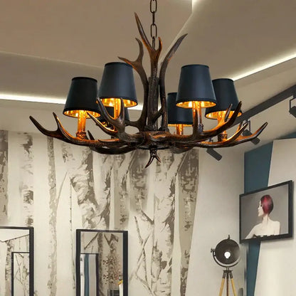 DecorBites antler chandelier with dark bronze finish and black lampshades for rustic bedroom and dining room lighting