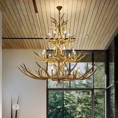 Golden antler deer chandelier with multiple tiers and candle-style bulbs by decorbites antler for living room and loft