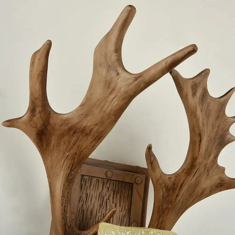 Brown rustic wooden antler decor vintage wall lamp with natural wood grain finish for living room and bedroom sconce