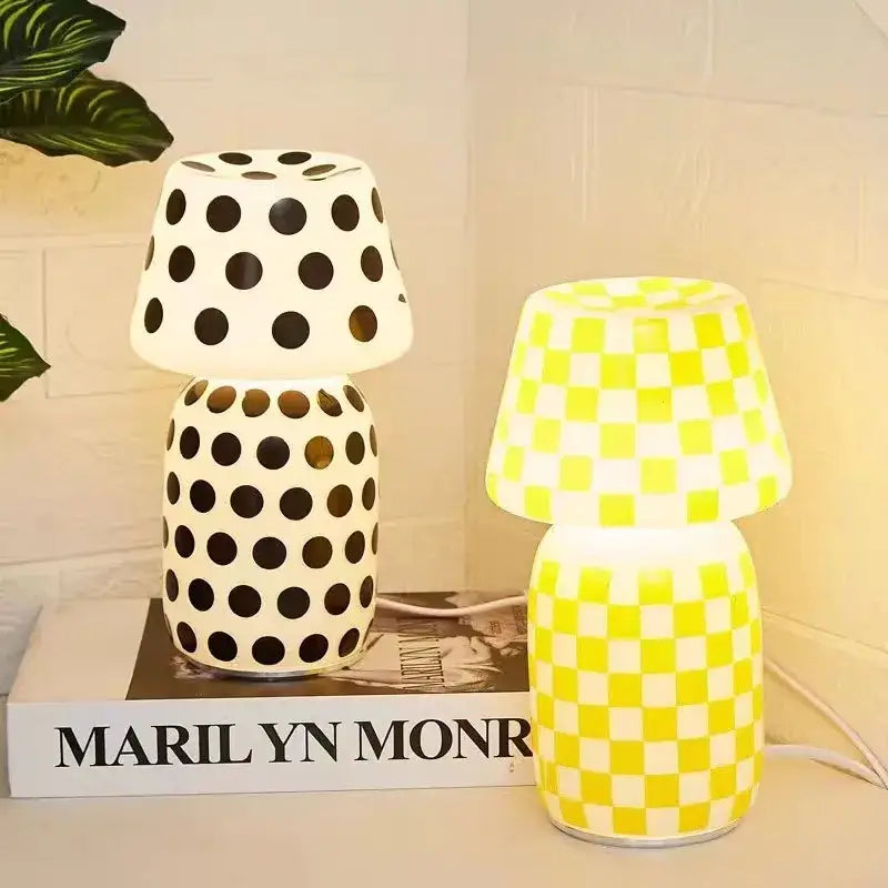 Two decorative table lamps including a white polka dot and bright yellow checkered decorbites apollo mushroom glass model