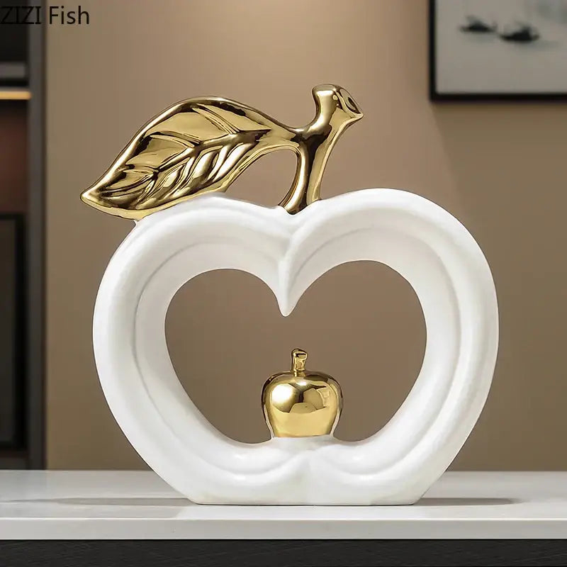 Decorbites apple sculpture white ceramic with gold leaf and stem featuring smaller golden apple in heart-shaped cutout