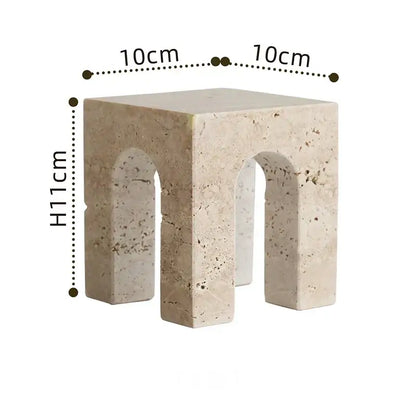 Beige stone side table with archway shape cutouts and textured natural finish by DecorBites archway shape travertine