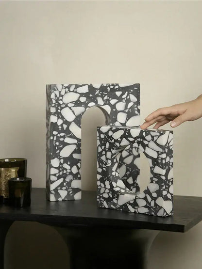 Black and white terrazzo sculpture bookends with speckled stone texture decorbites archway terrazzo for home decor