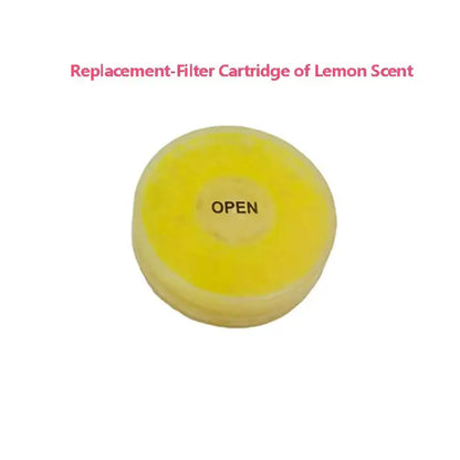 A bright yellow circular replacement filter cartridge with open label for DecorBites aroma shower head filtration