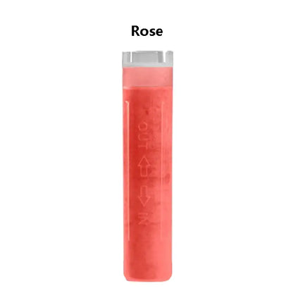 A translucent rose-colored cylindrical shower head filter cartridge with clear cap and embossed directional arrows for skin care