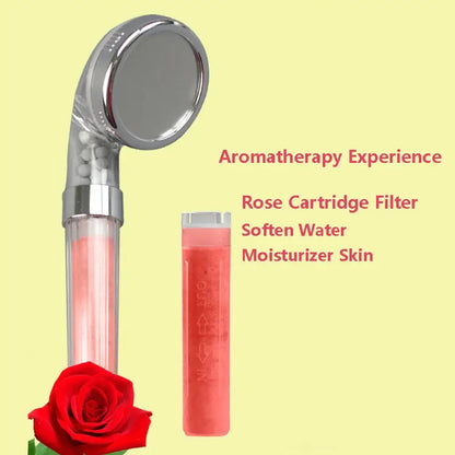 A sleek chrome shower head with a transparent body showing pink rose-infused water and a matching filter cartridge