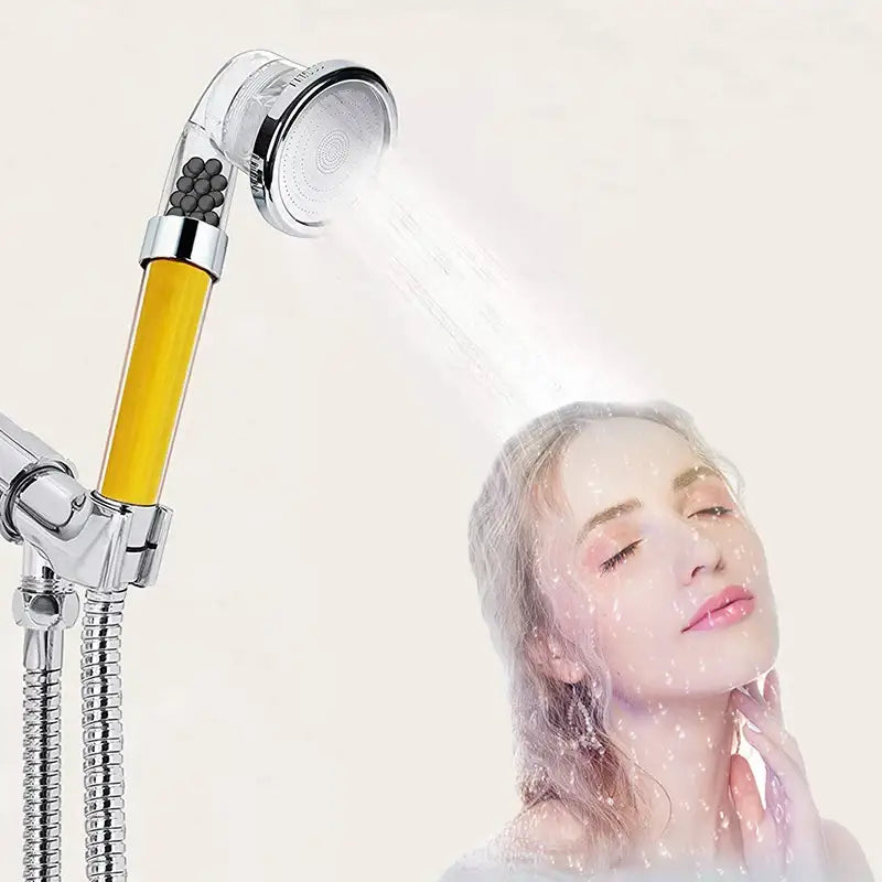 DecorBites™ chrome shower head with yellow filter cartridge and transparent water flow chamber for vitamin c skin care