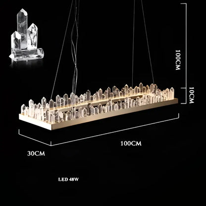 A modern decorbites arrow crystal led chandelier with a gold base and clear faceted crystals for living dining rooms