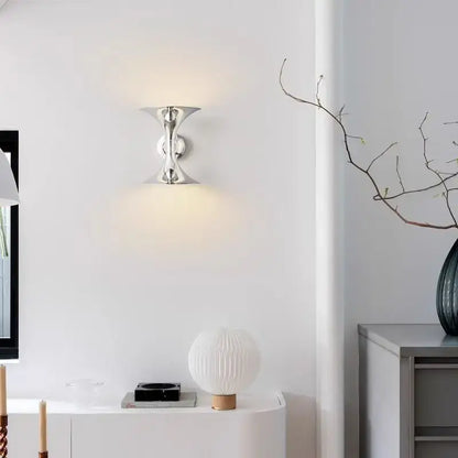 Silver metallic decorbites™ art deco chrome horn wall light with sleek sculptural design and two curved arms for indoor lighting