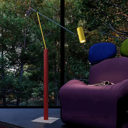 Modern decorbites art deco colorful metal floor lamp with red base yellow gray rotating arms and glowing yellow light head