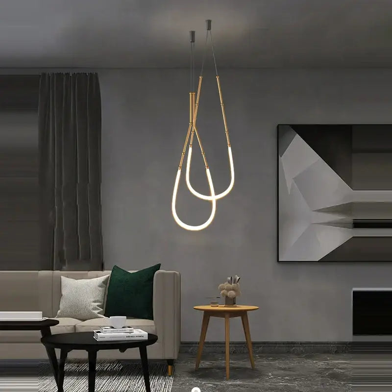 Decorbites art deco gold black pendant light with sleek curved design and glowing led illumination for dining room