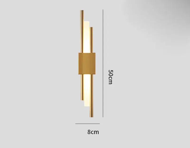 Modern gold-toned DecorBites Art Deco wall sconce with three cylindrical arms and marble accent emitting warm light