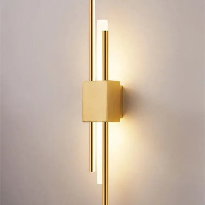 Modern gold-toned DecorBites Art Deco wall sconce with sleek vertical rods and marble accent for bedroom and living room lighting
