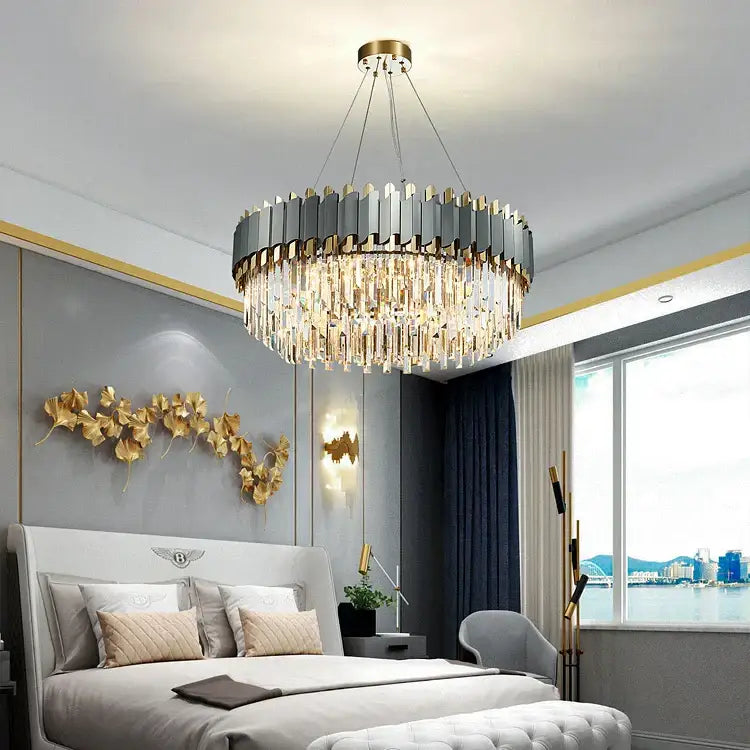 Decorbites art deco pendant lights feature a modern metallic gray and gold circular frame with clear crystal prisms