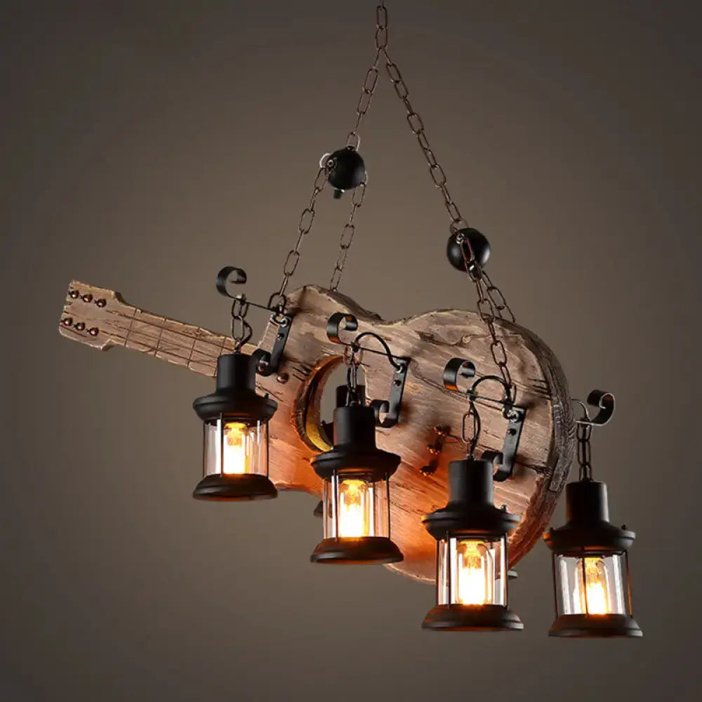 Rustic guitar pendant light with four black lantern-style lights in light wood and black metal finish by decorbites