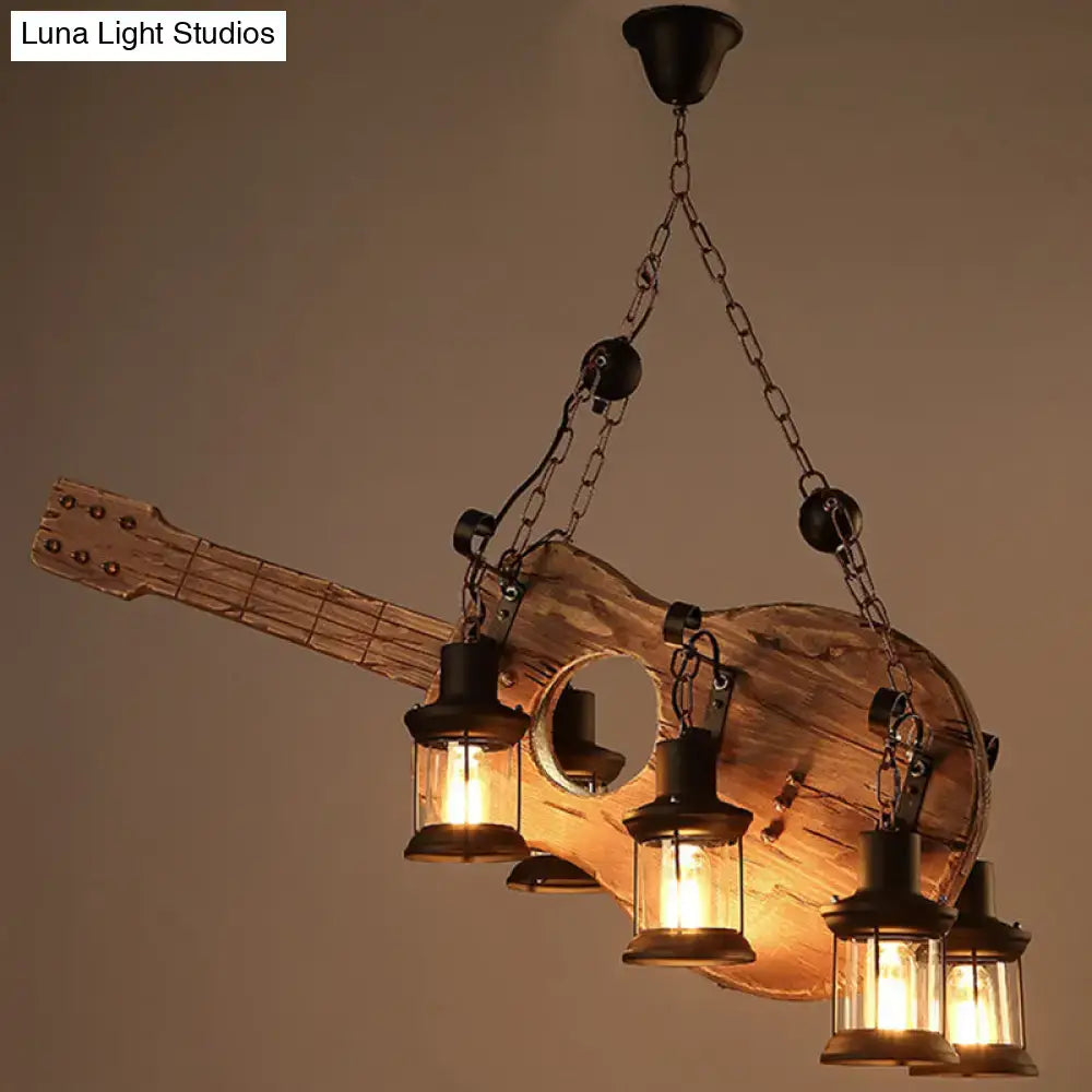 Rustic guitar pendant light with light wood and black metal finish featuring four lantern-style lights hanging from chains