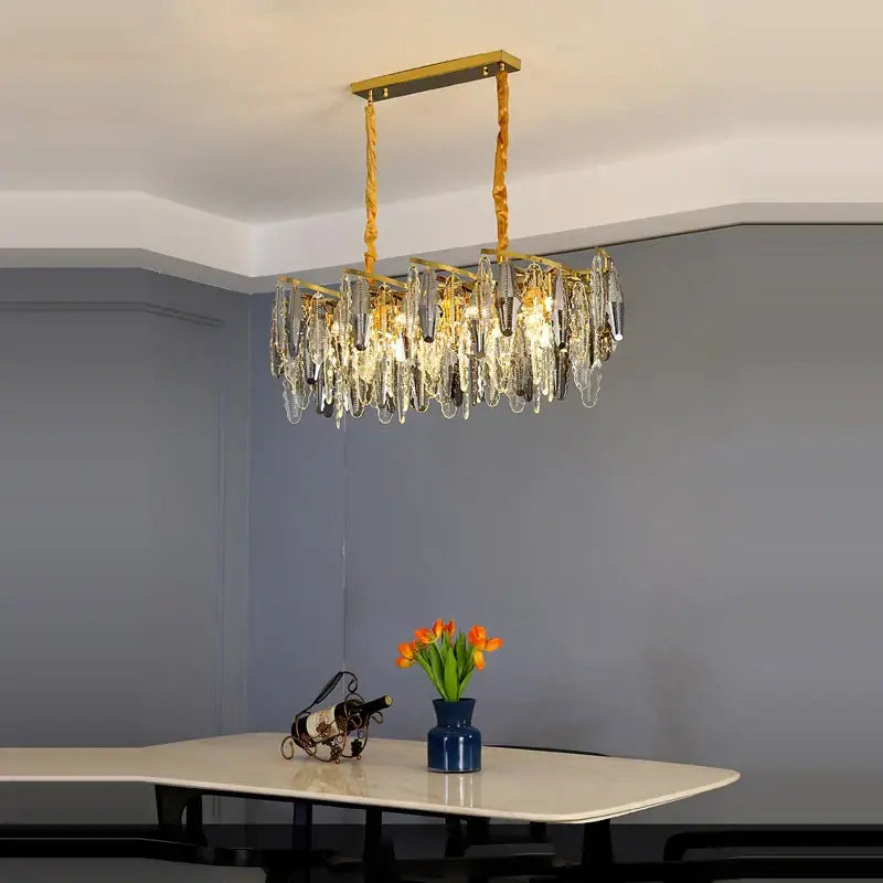 Gold-toned decorbites art deco led crystal chandelier with cascading clear and smoky crystal droplets for foyer lighting
