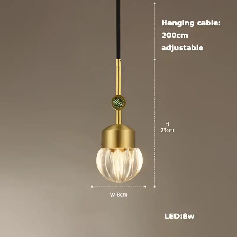 Gold-toned decorbites art deco pendant light with textured faceted glass globe and adjustable black cable vintage style