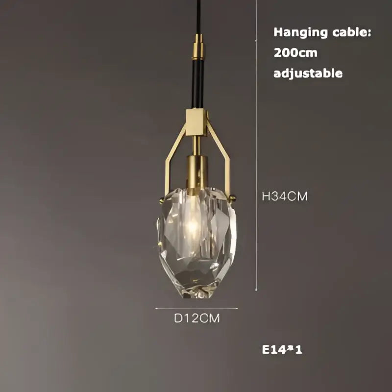 A decorbites art deco pendant light with a faceted crystal glass shade and brass-finished adjustable metal frame