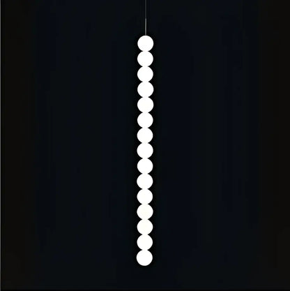 A sleek DecorBites Art Deco pendant light with vertical white spherical LED bulbs in gold chrome and black finish