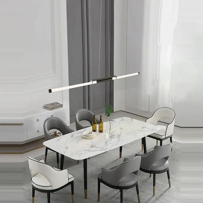 Modern marble dining table with sleek black legs paired with decorbites art deco led gold chandelier for dining room
