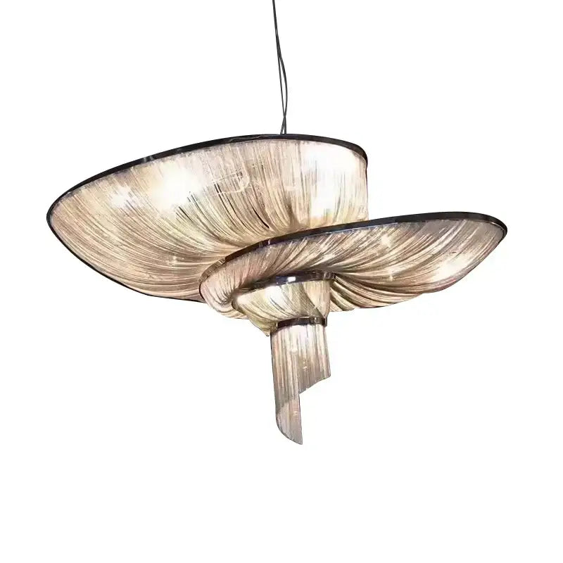 A modern two-tiered decorbites art deco led pendant light with translucent amber ribbed glass and black metal accents