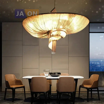 Golden intricately woven decorbites art deco led aluminum chain chandelier with modern spiral design above dining table