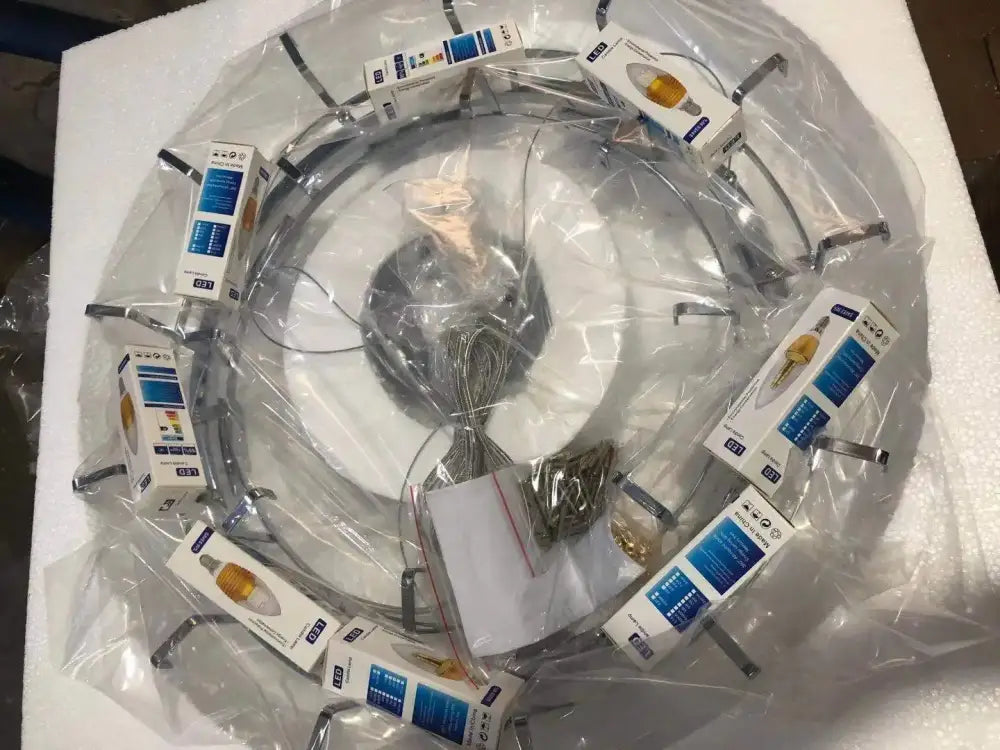 Circular metal ring light fixture with multiple packaged led bulbs in decorbites art deco white glass feather chandelier