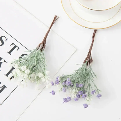 Two artificial gypsophila plants with light green stems and tiny white and purple blossoms for home decor and weddings