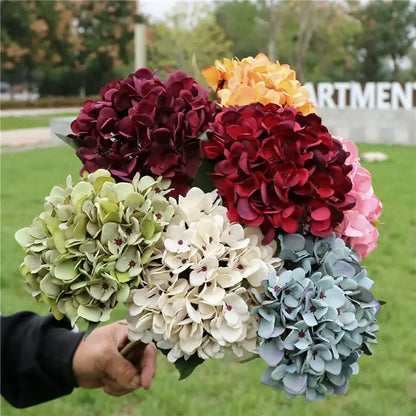 A vibrant decorbites™ artificial hydrangea wedding bouquet in burgundy pink white and blue green for indoor decoration