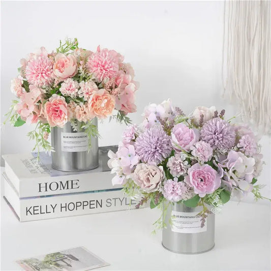 Two pastel decorbites artificial peony flower bouquets with pink peach and lavender blooms in silver containers for decoration